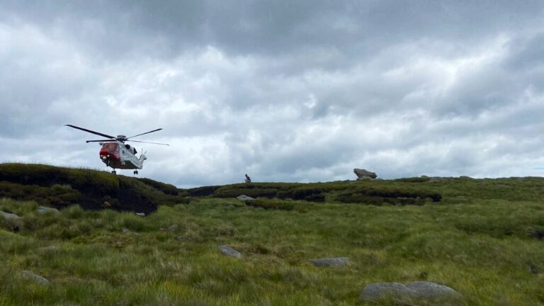Helicopter landing at Sandy Heyes